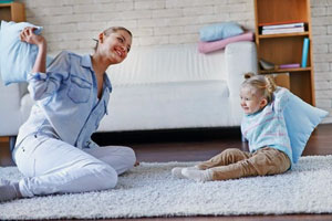 baby sitter playing with child