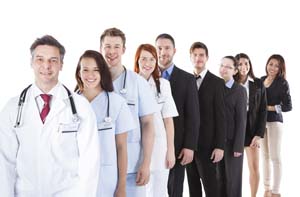 workplace staff standing in a group