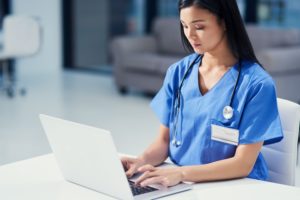 nurse using laptop