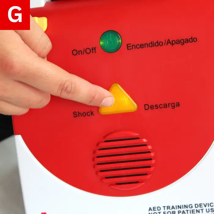 Press and hold the “shock” button until the AED delivers the shock