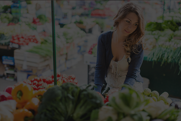 Nurse at farmers market choosing healthy options