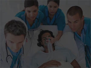 shaded image of health care providers assiting patient