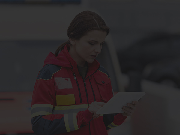 paramedic-in-uniform-holding-tablet