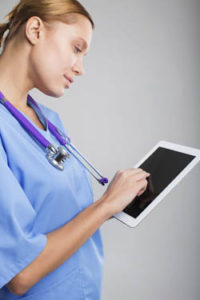 nurse using tablet computer