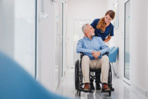 md-pushing-a-patient-in-wheelchair