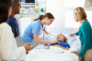 child-sick-in-hospital-bed-with-her-parents