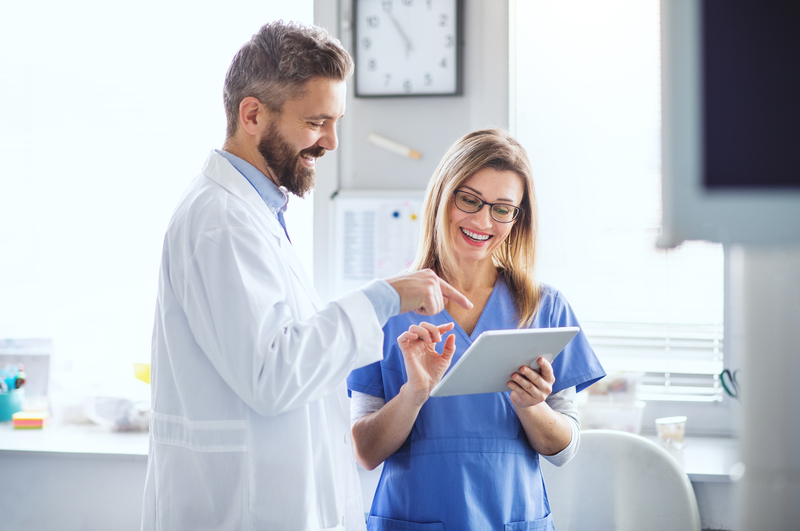 doctor and nurse discussing online certification courses